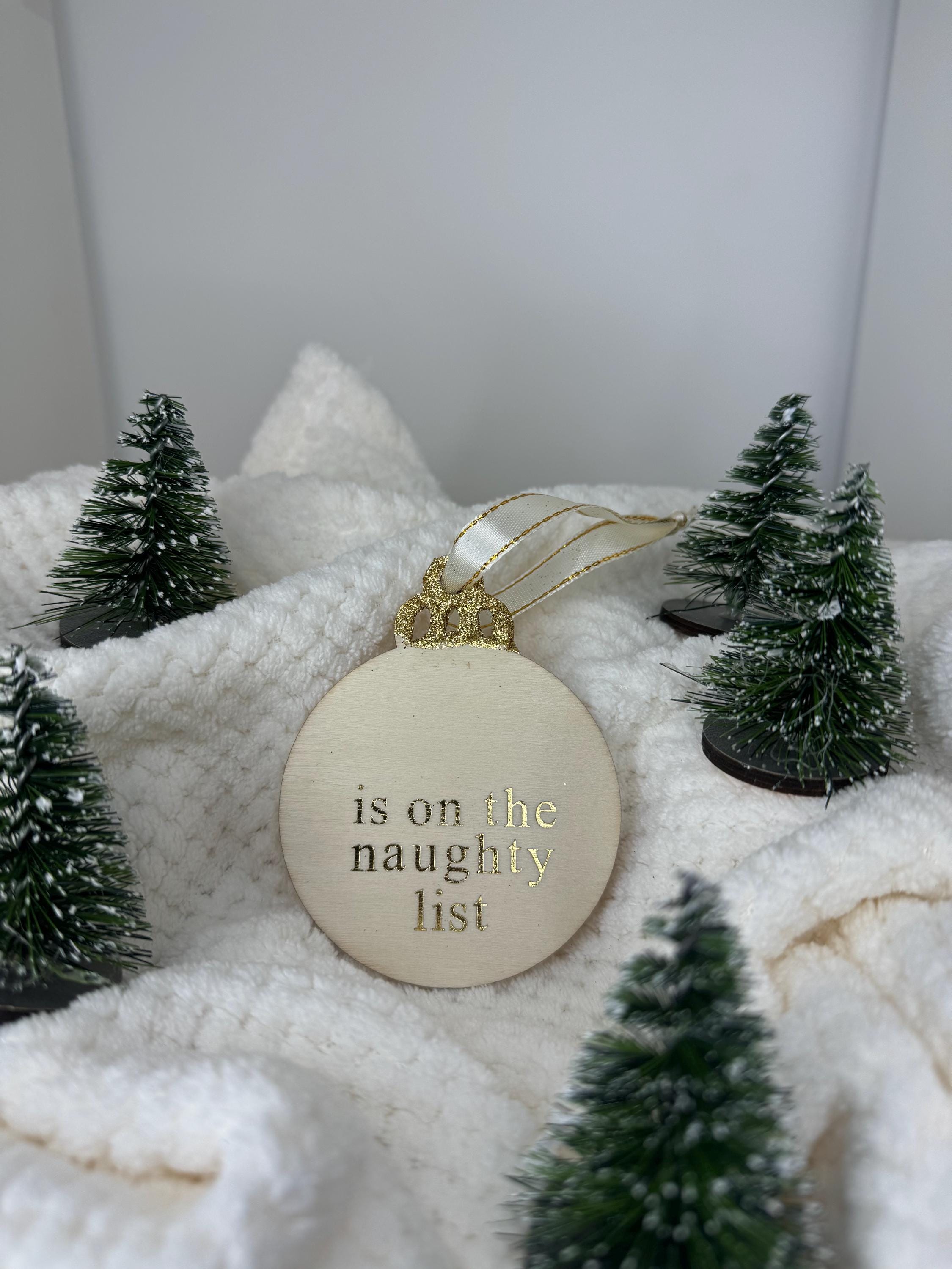 Personalised Christmas decorations, round bauble with gold letters.