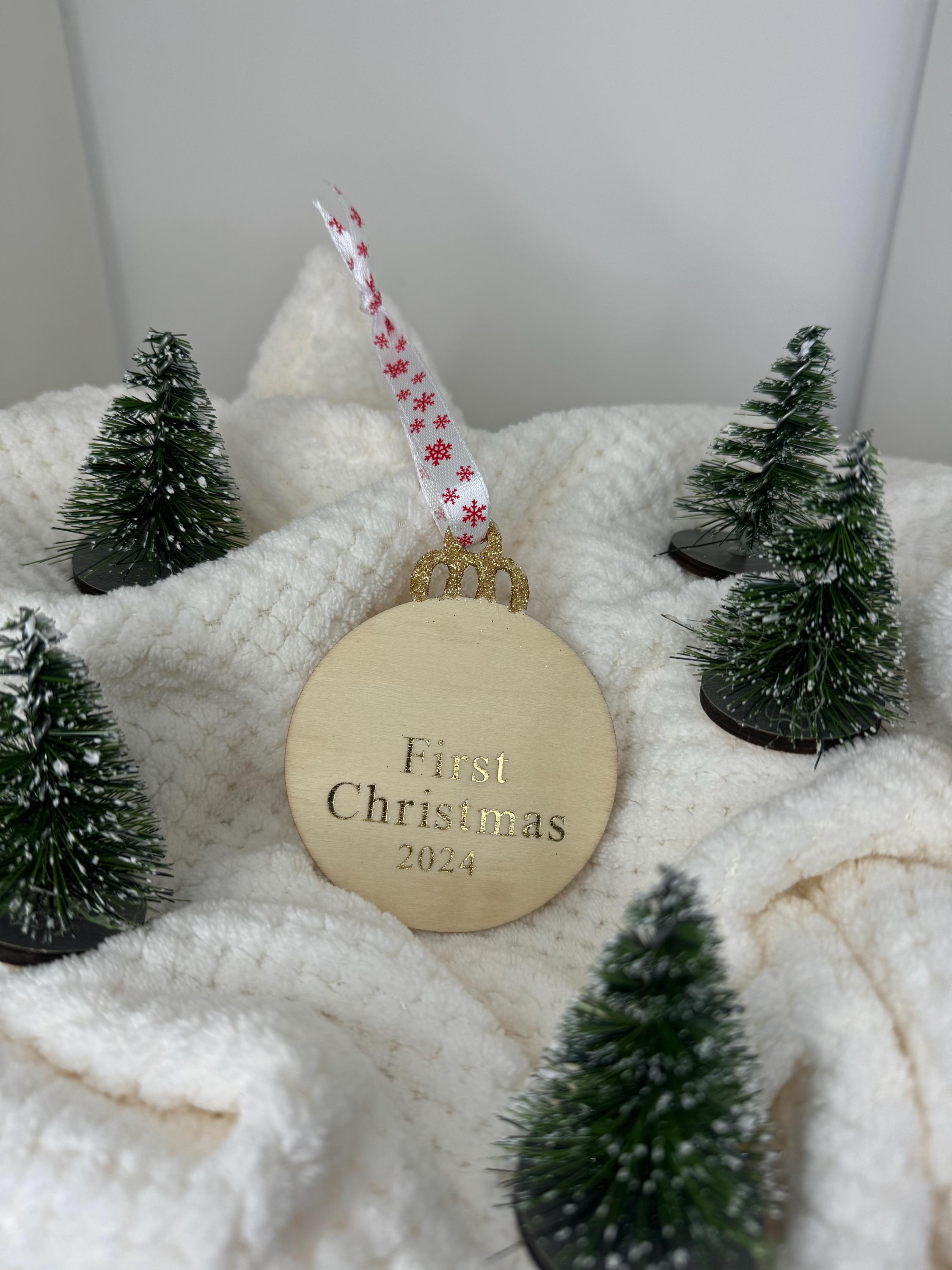 Personalised Christmas decorations, round bauble with gold letters.
