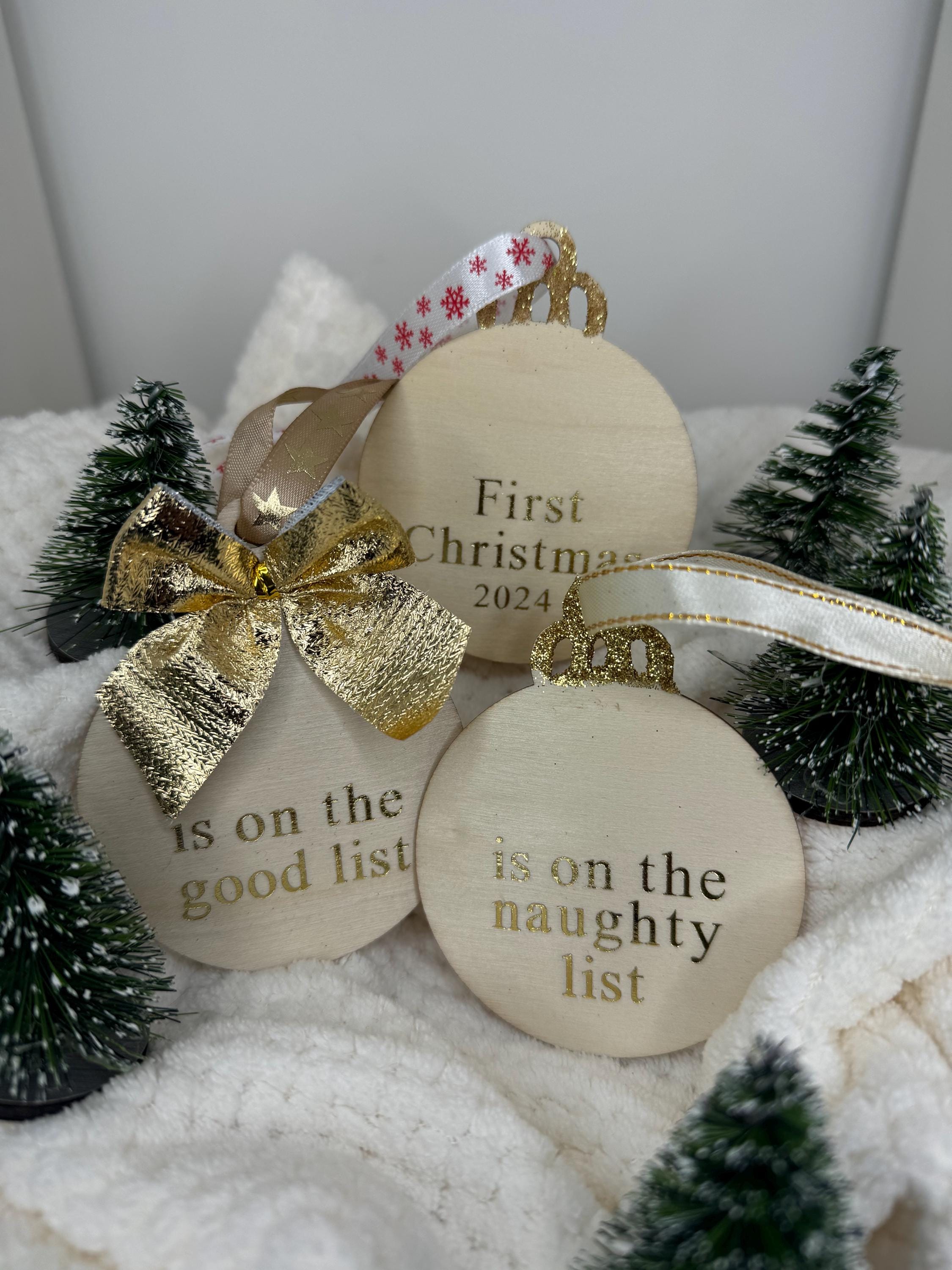 Personalised Christmas decorations, round bauble with gold letters.