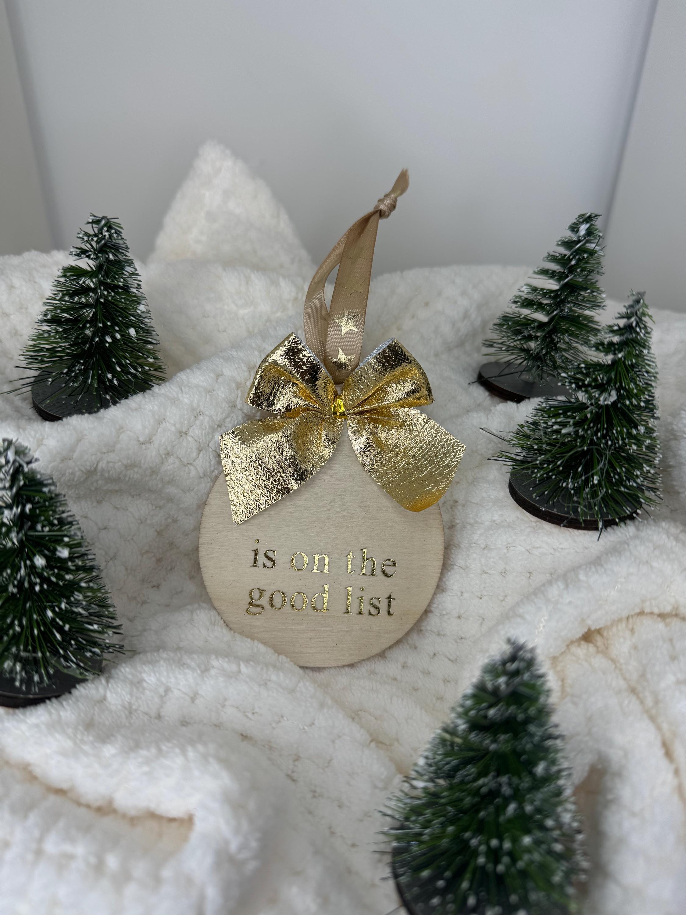 Personalised Christmas decorations, round bauble with gold letters.